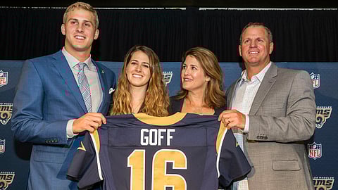 CORRECTS TO NANCY GOFF-File-This April 29, 2016, file photo shows California’s Jared Goff posing for photos with his family after being selected by the Los Angeles Rams as the first pick in the first round of the NFL football draft, in Los Angeles. From left, Jared Goff with sister, Lauren Goff and parents, Nancy Goff and Jerry Goff. The Montreal Expos would be thrilled with this Super Bowl, and those who used to be part of the extinct baseball franchise’s evaluation process certainly are, even all these years later. Gone from the game for nearly 15 years, the former club has ties to both quarterbacks in Sunday’s NFL championship game. The Expos traded for Jared Goff’s father, Jerry, nearly three decades ago. Goff made his major league debut for Montreal in 1990 and played 55 games for the team as a backup catcher that year and in 1992. (AP Photo/Damian Dovarganes, File)