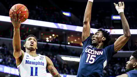 Memphis’ Antwann Jones Jr., goes up for a shot against UConn’s Sidney Wilsonin February. If UConn moves back to the Big East they’ll be back playing St. John’s, Villanova and Georgetown. (Brad Vest/The Commercial Appeal via AP)