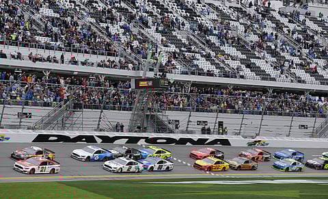 Paul Menard (21) and Kyle Busch, top left, lead the field to start the NASCAR Clash  at Daytona International Speedway, Sunday, Feb. 10, 2019 (AP Photo/Terry Renna)