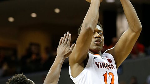 Virginia guard De’Andre Hunter (12) takes a shot over Notre Dame guard TJ Gibbs (10) in Charlottesville, Va., Saturday, Feb. 16, 2019. (AP Photo/Steve Helber)