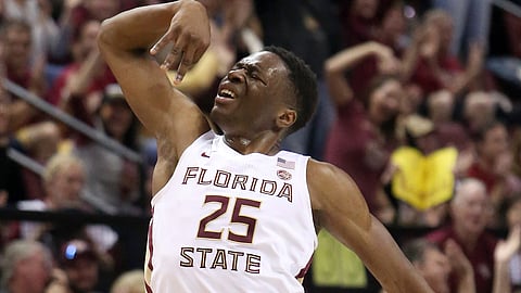 Florida State’s Mfiondu Kabengele celebrates after hitting a three-point basket in the first half of an NCAA college basketball game against Louisville. (AP Photo/Steve Cannon)