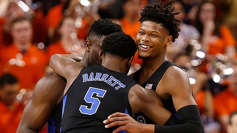Duke’s Zion Williamson, RJ Barrett and Cam Reddish celebrate the team’s 81-71 victory over Virginia, Saturday, Feb. 9, 2019. (Mark Gormus/Richmond Times-Dispatch via AP)