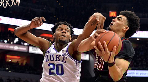 Louisville’s Jordan Nwora runs into Duke’s Marques Bolden Tuesday 