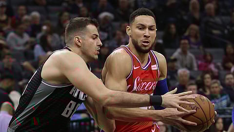 Ben Simmons drives against Kings’ Nemanja Bjelica