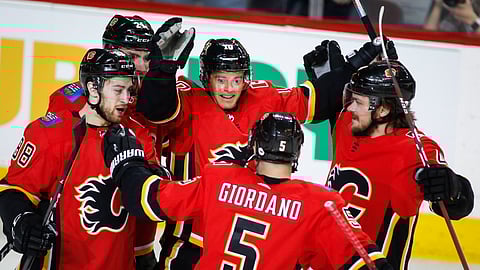 The Flames celebrate a goal.