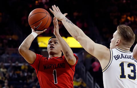 Maryland’s Anthony CowanJr. shoots over Michigan’s Ignas Brazdeikis Saturday