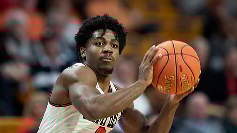 Campbell’s Chris Clemons looks to pass in a January game against Presbyterian (Jason E. Miczek)