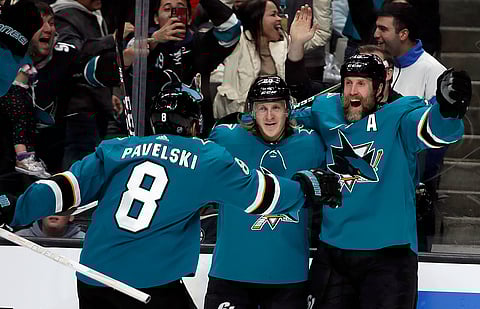 Sharks’ Joe Pavelski and Marcus Sorensen celebrate goal by Joe Thornton (right) Monday