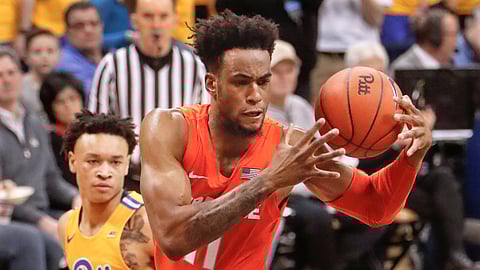 Syracuse’s Oshae Brissett, right, gets the ball as Pittsburgh’s Trey McGowens, left, defends during the second half of an NCAA college basketball game, Saturday, Feb. 2, 2019, in Pittsburgh. (AP Photo/Keith Srakocic)