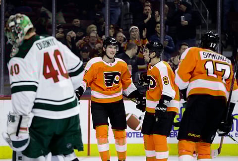 Flyers celebrate the first victory of what is now an eight-game winning streak
