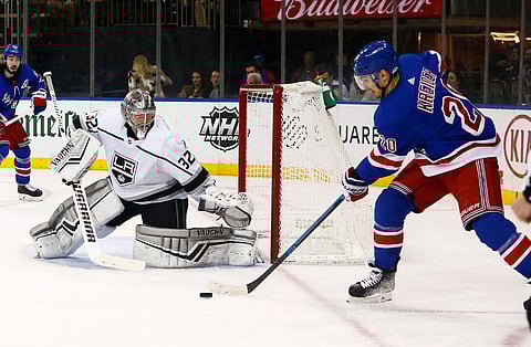Kings goaltie Jonathan Quick defends against Rangers left wing Chris Kreider