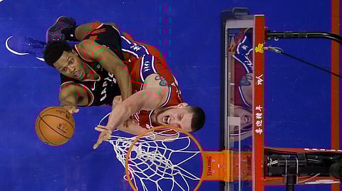 Toronto Raptors’ Kyle Lowry, left, tries to get a shot past Philadelphia 76ers’ Mike Muscala during the second half of an NBA basketball game Tuesday, Feb. 5, 2019, in Philadelphia. Toronto won 119-107. (AP Photo/Matt Slocum)
