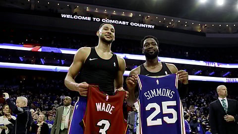 Philadelphia 76ers’ Ben Simmons, left, and Miami Heat’s Dwyane Wade pose after swapping jerseys Thursday, Feb. 21, 2019, in Philadelphia. (AP Photo/Matt Slocum)