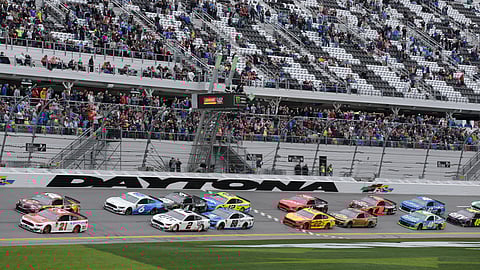 Paul Menard (21) and Kyle Busch lead the field to start the NASCAR Clash auto race at Daytona International Speedway, Sunday, Feb. 10, 2019. (AP Photo/Terry Renna)