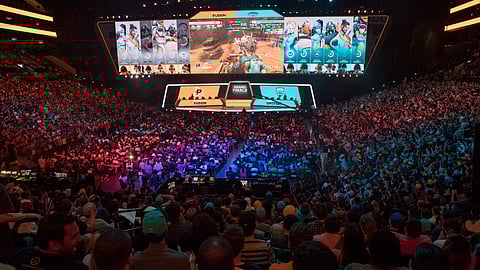 FILE - In this July 28, 2018, file photo, fans watch the competition between Philadelphia Fusion and London Spitfire during the Overwatch League Grand Finals competition at Barclays Center in Brooklyn. (AP Photo/Mary Altaffer, File)