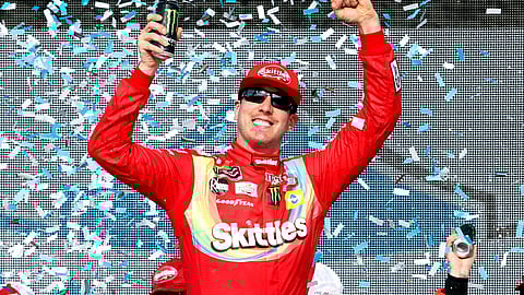 Kyle Busch celebrates in Victory Lane after winning the NASCAR Cup Series auto race at ISM Raceway on March 10, 2019.