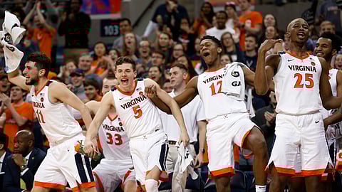Virginia guard Ty Jerome, left, guard Kyle Guy, guard De’Andre Hunter and forward Mamadi Diakite celebrate during a college basketball game against Georgia Tech. (Steve Helber)