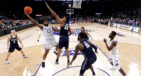 Seton Hall guard Myles Powell goes up for a shot againstGeorgetown guard Kaleb Johnson Thursday (Julio Cortez)