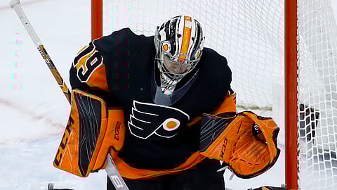 Philadelphia Flyers’ Carter Hart cannot block a shot by New York Islanders’ Josh Bailey during the game on March 23, 2019.