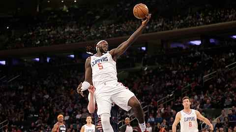 Clippers forward Montrezl Harrell grabs a high pass  against the Knicks Sunday  (Seth Wenig)