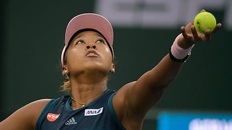 Naomi Osaka, of Japan, serves to Danielle Collins at the BNP Paribas Open tennis tournament Monday, March 11, 2019, in Indian Wells, Calif. (AP Photo/Mark J. Terrill)