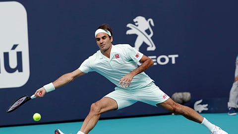 Roger Federer, of Switzerland, returns to Radu Albot, of Moldova, during the Miami Open tennis tournament on March 23, 2019.