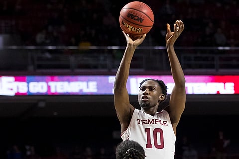 Temple’s Shizz Alston rises up for a shot against Central Florida’s Chad Brown on March 9 (Chris Szagola)