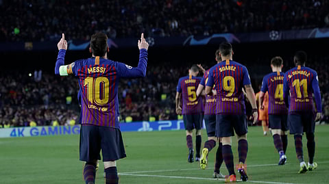 Barcelona’s Lionel Messi celebrates after scoring in soccer match between FC Barcelona and Olympique Lyon, March 13, 2019. (AP Photo/Emilio Morenatti)