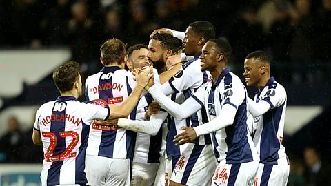 West Bromwich Albion’s Kyle Bartley, center, celebrates with teammates after scoring against Brighton & Hove, Wednesday, Feb. 6, 2019. (Aaron Chown/PA via AP)