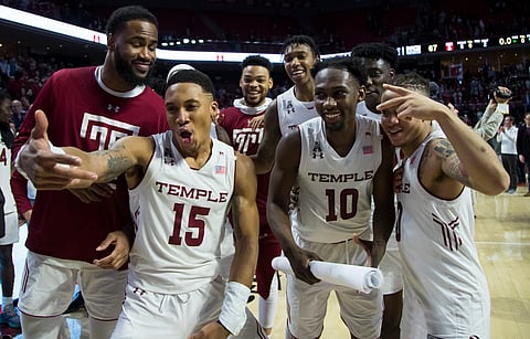 Temple players celebrate a win in their season finale Saturday (Chris Szagola)