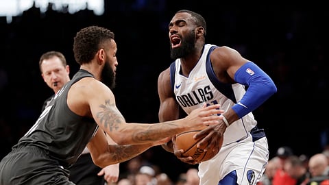 Brooklyn Nets guard Allen Crabbe, left, defends against Dallas Mavericks guard Tim Hardaway Jr., Monday, March 4, 2019, in New York. (AP Photo/Kathy Willens)