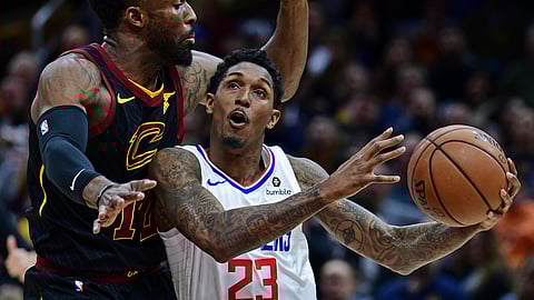 Los Angeles Clippers’ Lou Williams goes to the basket against Cleveland Cavaliers’ David Nwaba in a game on March 22, 2019.