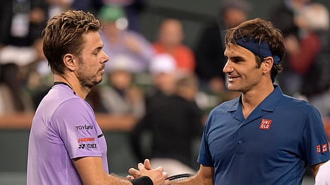 Stan Wawrinka (left) ongratulates Roger Federer after their match Tuesday (Mark J. Terrill)