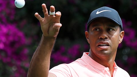 Tiger Woods prepares to catch a ball tossed by his caddie during the WGC-Mexico Championship golf tournament at the Chapultepec Golf Club in Mexico City on Feb. 22, 2019. (Marco Ugarte, File)
