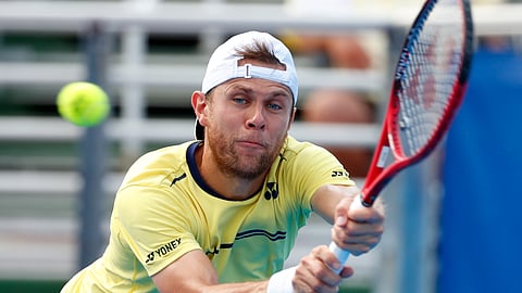 Radu Albot, of Moldova, returns a shot from Daniel Evans, of Britain, during the final tennis match at the Delray Beach Open,Feb. 24, 2019. (Wilfredo Lee)