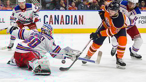 New York Rangers goaltender Alexandar Georgiev stops Edmonton Oilers’ Colby Cave during an NHL hockey game, March 11, 2019. (Amber Bracken/The Canadian Press via AP)