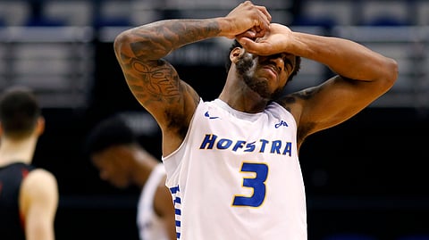 In last year's CAA final, Hofstra’s Justin Wright-Foreman covers his eyes. (Mic Smith)