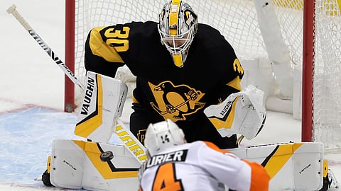 Flyers’ Sean Couturier fires the game-winning shoot-out goal past Pittsburgh’s Matt Murray Sunday (Gene J. Puskar)