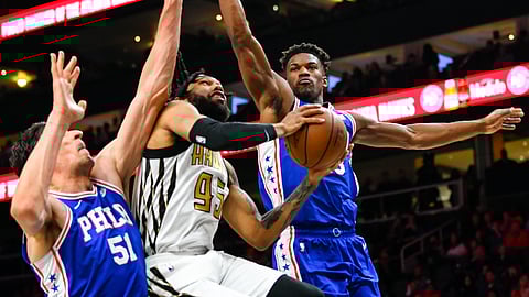Atlanta Hawks forward DeAndre’ Bembry, from St. Joseph’s splits the Sixers defense, which better be better tonight. (AP Photo/John Amis)