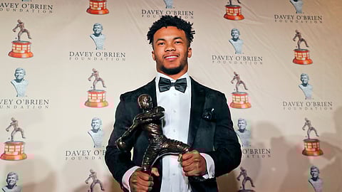 Heisman Trophy winning quarterback Kyler Murray poses with the Davey O’Brien football award. (LM Otero)