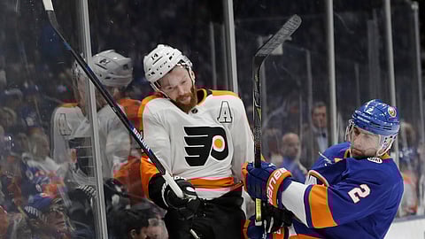 New York Islanders’ Nick Leddy checks Philadelphia Flyers’ Sean Couturier during the game on March 9, 2019. (Frank Franklin II)