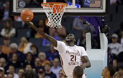 Florida State’s Christ Koumadje drives to the basket against Virginia Tech Thursday (Chuck Burton)