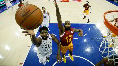 Philadelphia 76ers’ Joel Embiid goes up for a shot past Indiana Pacers’ Kyle O’Quinn during the game on March 10, 2019.