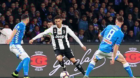 Juventus’ Cristiano Ronaldo goes for the ball during the match between Napoli and Juventus, March 3, 2019. (Cesare Abbate/ANSA via AP)