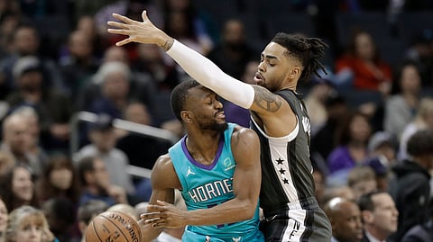 Brooklyn’s D’Angelo Russell defends Charlotte’s Kemba Walker in a Feb. 23 game (Chuck Burton)