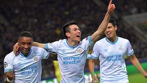 PSV’s Hirving Lozano, center, celebrates after scoring a goal last year at the San Siro stadium in Milan, Italy on Dec. 11, 2018. ( via AP)