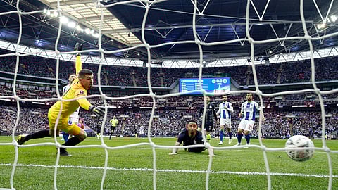 Manchester City’s Gabriel Jesus scores the opening goal during the English FA Cup semifinal soccer match between Manchester City and Brighton & Hove Albion at Wembley Stadium on April 6, 2019. 