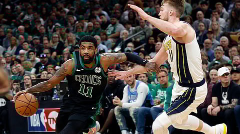 Boston Celtics’ Kyrie Irving drives on Indiana Pacers’ Domantas Sabonisn during the second quarter in Game 1 of a first-round NBA basketball playoff series, Sunday, April 14, 2019.