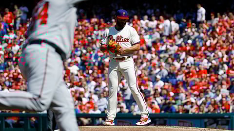 Phillies’ Jake Arrieta waits for Minnesota’s Willians Astudillo to complete home run trot on April 6 (Matt Slocum)