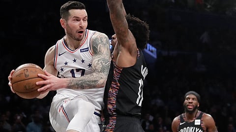 The Sixers’ JJ Redick -- playing in his 13th consecutive postseason -- drives on Brooklyn’s Ed Davis in Game 3 on April 18 (Frank Franklin III)